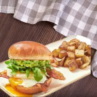 First Watch Elevated Egg Sandwich with over-easy eggs, bacon, avocado, and melted cheese – 2025 menu