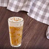 "First Watch Honey Caramel Crunch iced coffee with caramel, honey drizzle, and crunchy topping – 2025 menu beverage"