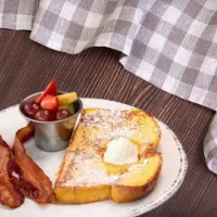"First Watch Kids French Toast dusted with powdered sugar – 2025 menu"