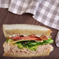 First Watch Monterey Club Sandwich with turkey, bacon, avocado, and tomato on sourdough – 2025 menu